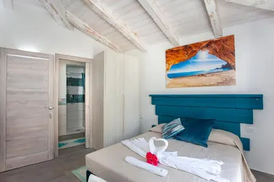 Letto o letti in una camera di Villa Elisir Luxury - Le Residenze del Mare