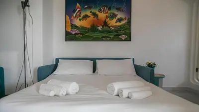 Letto o letti in una camera di Panoramica attic room - Cala Gonone