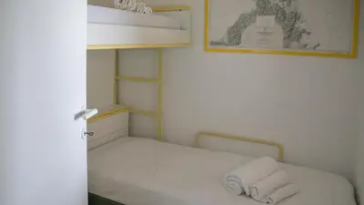 Letto o letti in una camera di Panoramica attic room - Cala Gonone