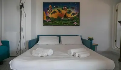 Letto o letti in una camera di Panoramica attic room - Cala Gonone