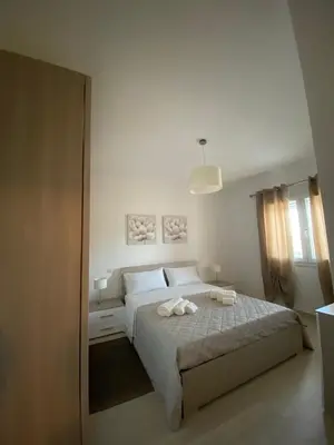 Letto o letti in una camera di Casa vacanze Olbia - ALEBEA -