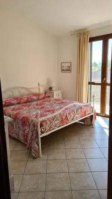 Letto o letti in una camera di La Coccinella