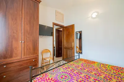Letto o letti in una camera di Appartamento Trilocale Le Canne 4 posti letto con giardino e posto auto privato