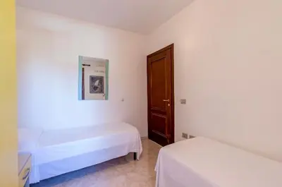 Letto o letti in una camera di Holiday House Olbia Downtown (giardino e ingresso indipendente)