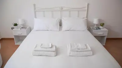 Letto o letti in una camera di Prestigiosa Garden - Cala Gonone