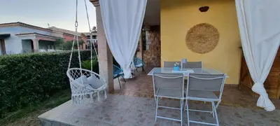 Patio o area all'aperto di Casa Cala Sardegna Budoni Residence con Piscina