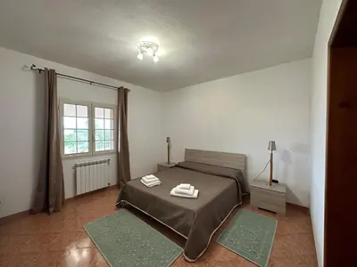 Letto o letti in una camera di Domo Mia