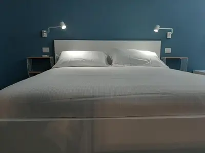 Letto o letti in una camera di Kore Home