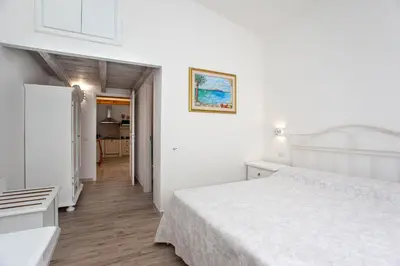 Letto o letti in una camera di La Casa in Collina - affittacamere con vista mare