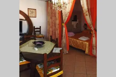 Letto o letti in una camera di La Cuppulata - Stile Classico
