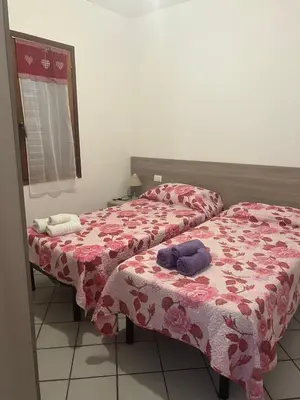 Letto o letti in una camera di San Teodoro centro