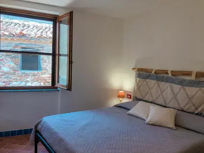 Letto o letti in una camera di panoramic LOFT Fora e ' Muros with sea view common terrace , Ammentos Posada