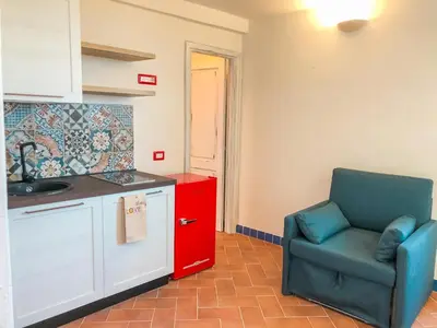 Cucina o angolo cottura di panoramic LOFT Fora e ' Muros with sea view common terrace , Ammentos Posada