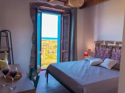 Letto o letti in una camera di panoramic ROOMS Fora e ' Muros with sea view common terrace , Ammentos Posada