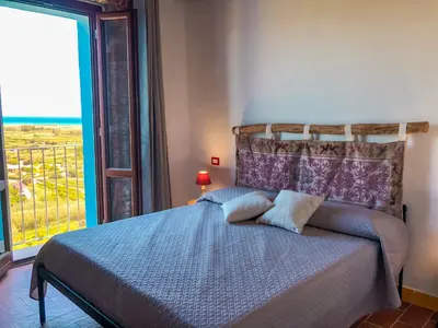 Letto o letti in una camera di panoramic ROOMS Fora e ' Muros with sea view common terrace , Ammentos Posada