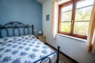 Letto o letti in una camera di Appartamento La Collinetta LT - PMS CaseVacanze