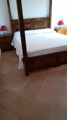 Letto o letti in una camera di APPARTAMENTI BELLA VISTA SU TAVOLARA