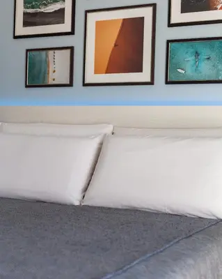 Letto o letti in una camera di J Rooms