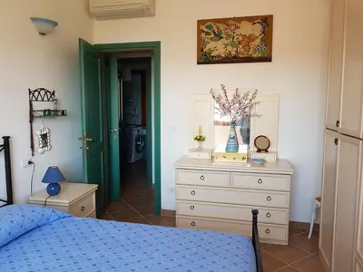 Letto o letti in una camera di ROSA DEI VENTI - CASA LEVANTE - Sardegna - IUN R2403
