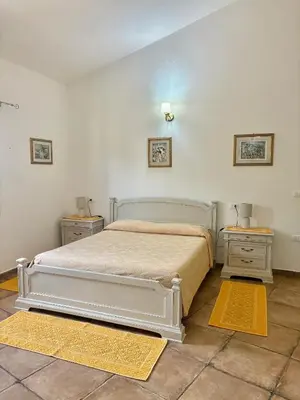 Letto o letti in una camera di Orosei Summer Holidays - Cala del Turco green house