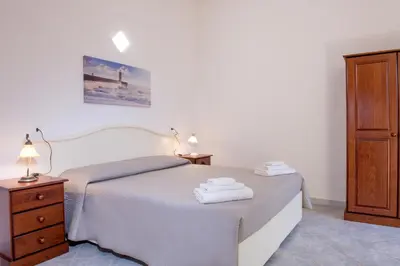 Letto o letti in una camera di Orosei Summer Holidays - Cala del Turco green house