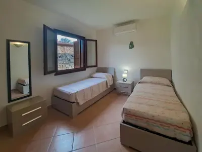 Letto o letti in una camera di Appartamento Residenziale Trilocale 4 posti letto Stella Marina