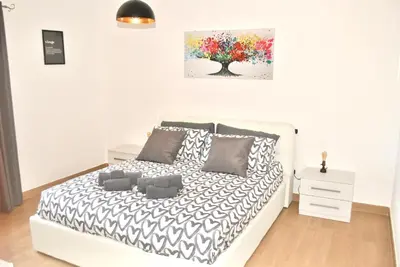 Letto o letti in una camera di Verba Mundi Guest House