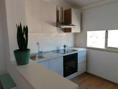 Cucina o angolo cottura di EFFE Apartment Golfo Aranci: Sole, Mare e Relax
