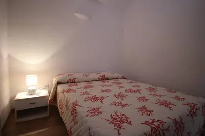 Letto o letti in una camera di EFFE Apartment Golfo Aranci: Sole, Mare e Relax