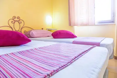 Letto o letti in una camera di Casa Lucia Relax