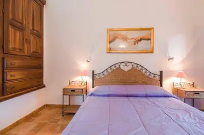 Letto o letti in una camera di Glicine