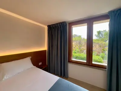 Letto o letti in una camera di La Finestra sul Mare Seaview Apartments