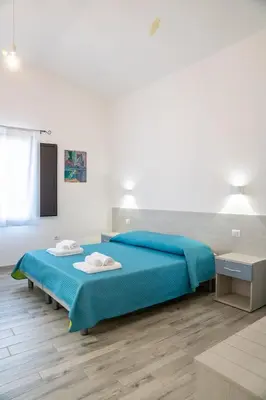Letto o letti in una camera di Affittacamere Su Portzu