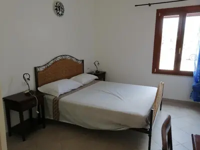 Letto o letti in una camera di Appartamento al centro di Budoni