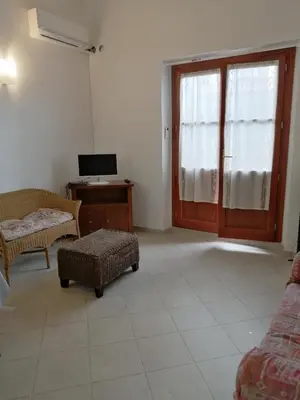 TV o dispositivi per l'intrattenimento presso Appartamento al centro di Budoni
