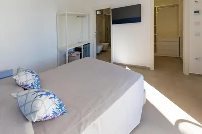 Letto o letti in una camera di Hotel Caramare