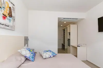 Letto o letti in una camera di Hotel Caramare