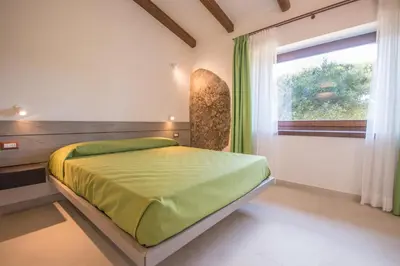 Letto o letti in una camera di Ginepro (Villa Capelvenere)