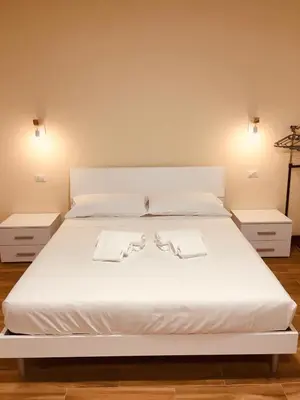 Letto o letti in una camera di Casa Maka'