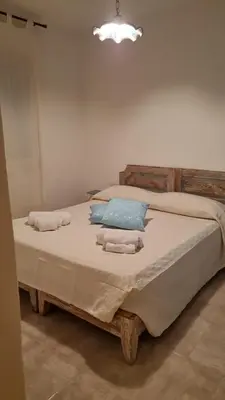 Letto o letti in una camera di Le Farfalle Appartamento in villa trifamiliare