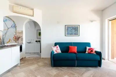 Area soggiorno di Sherden suites - Your House in Sardinia