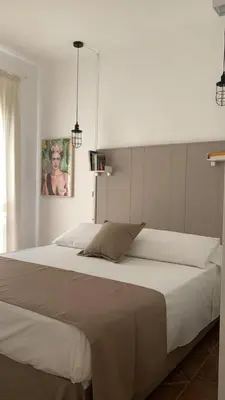Letto o letti in una camera di Casa Adelaide, oasi di pace con vista mare