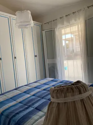 Letto o letti in una camera di Casa Maria