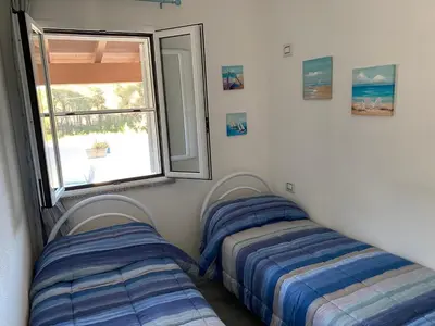 Letto o letti in una camera di Casa Maria