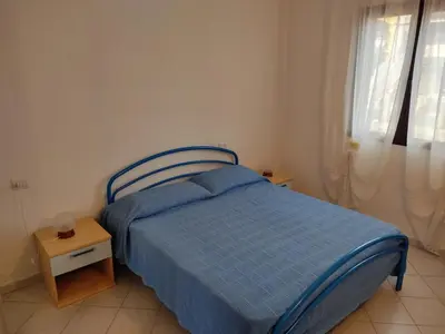Letto o letti in una camera di Appartamento a La Caletta