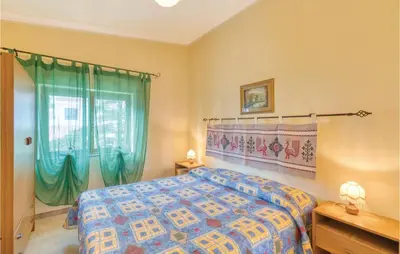 Letto o letti in una camera di Casa Camilla 2