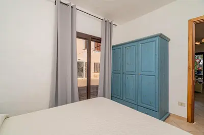 Letto o letti in una camera di Porto San Paolo Apartments