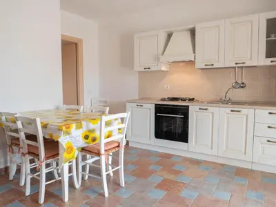 Cucina o angolo cottura di Villetta spiaggia a piedi BudoniAffitti