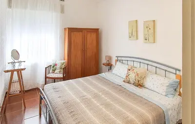 Letto o letti in una camera di Cozy Home In Orgosolo