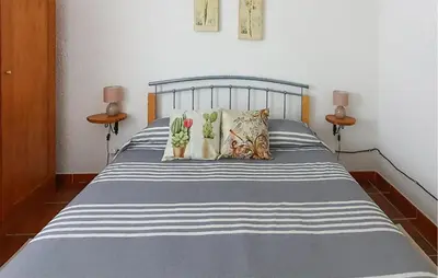 Letto o letti in una camera di Cozy Home In Orgosolo
